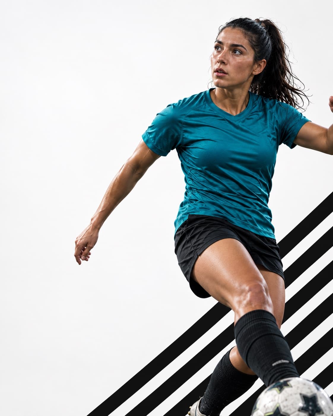 A soccer player mid-stride, about to strike the ball during a pickup game.